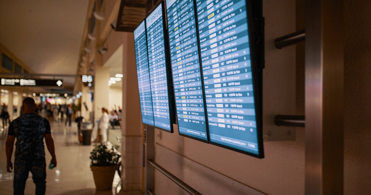 Airport departure board showing European flight destinations