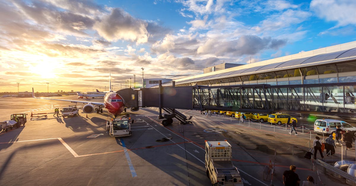 European airport at sunset with planes ready for international departures