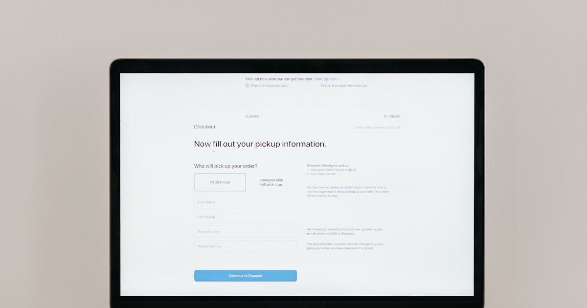 Laptop displaying online checkout form for digital payment processing