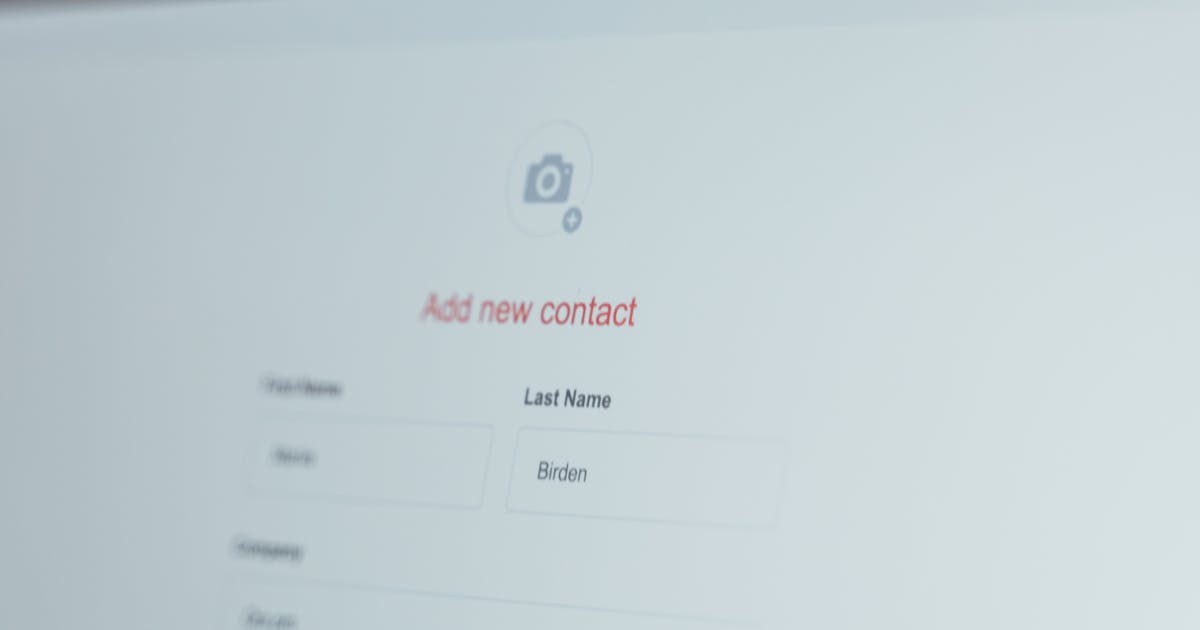 Person filling out an online travel authorization application form on computer