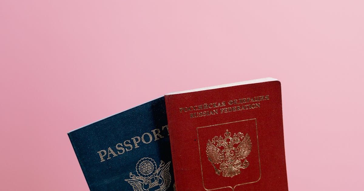 Person holding passports ready for ETIAS application and European travel
