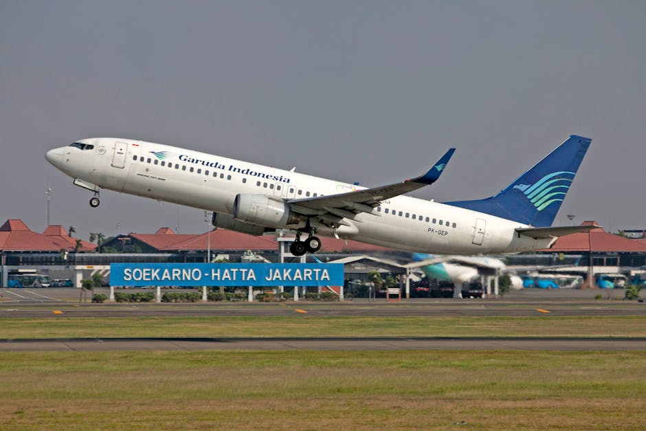 Garuda Indonesia Boeing 737 taking off from Soekarno-Hatta International Airport in Jakarta.