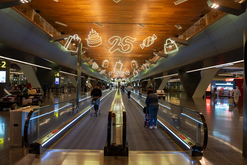 Dynamic scene of travelers at Doha Hamad International Airport with festive ceiling decor.