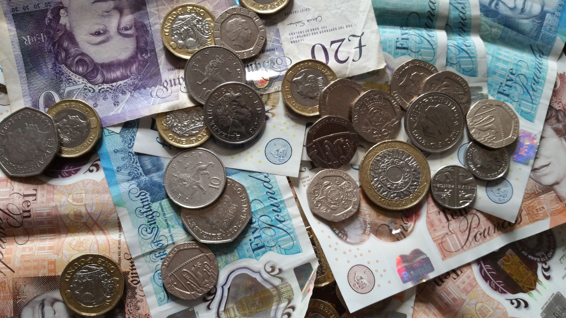 British pounds and euro coins side by side, currency comparison concept