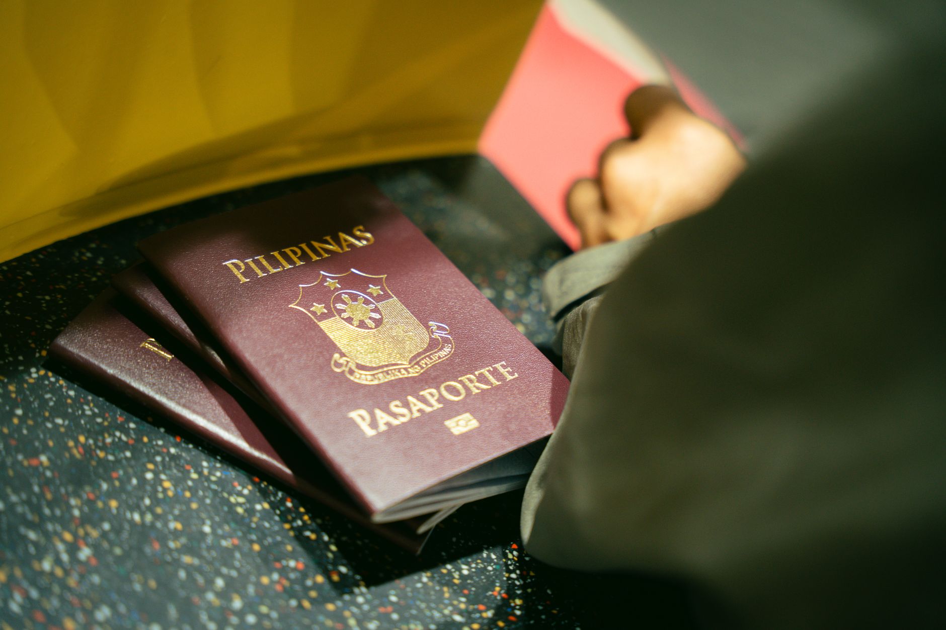 UK passport holder at European departure gate, ETIAS confirmation on phone screen