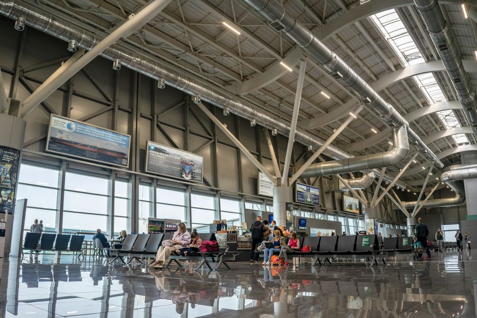 Inside the biggest airport in Europe with travellers at the terminal