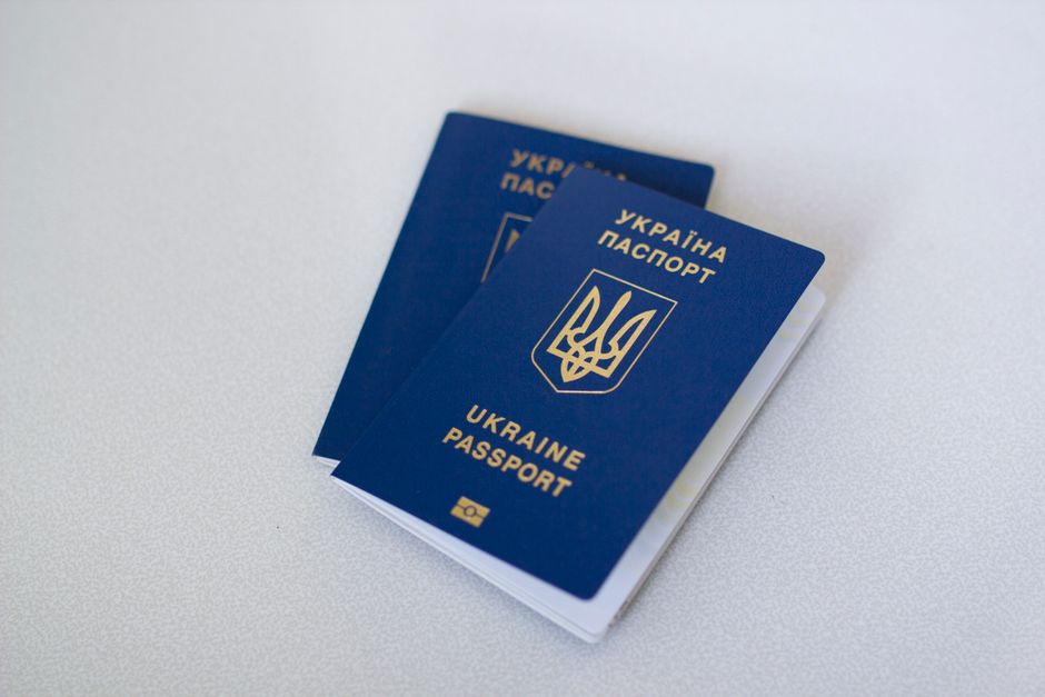 ETIAS name change concept with an open passport showing personal details in 2026