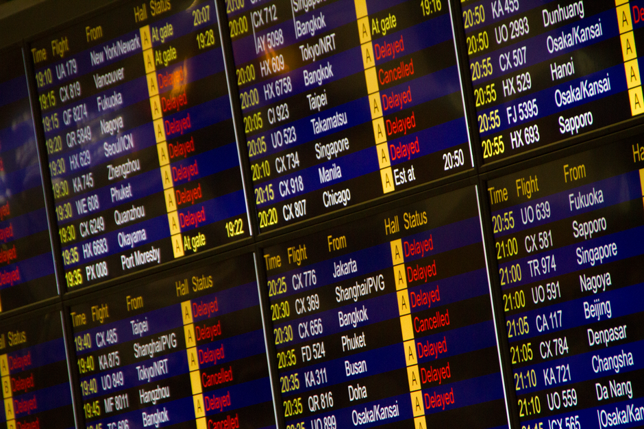 Departure board showing delays during December Europe travel strikes