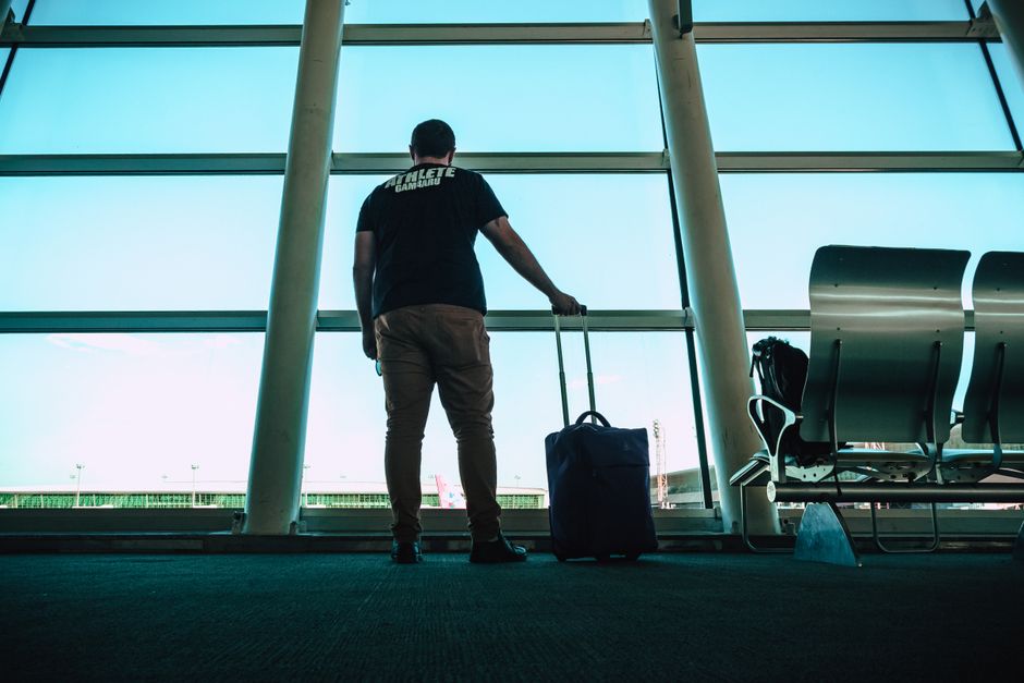 Traveller arriving at a large European airport with luggage