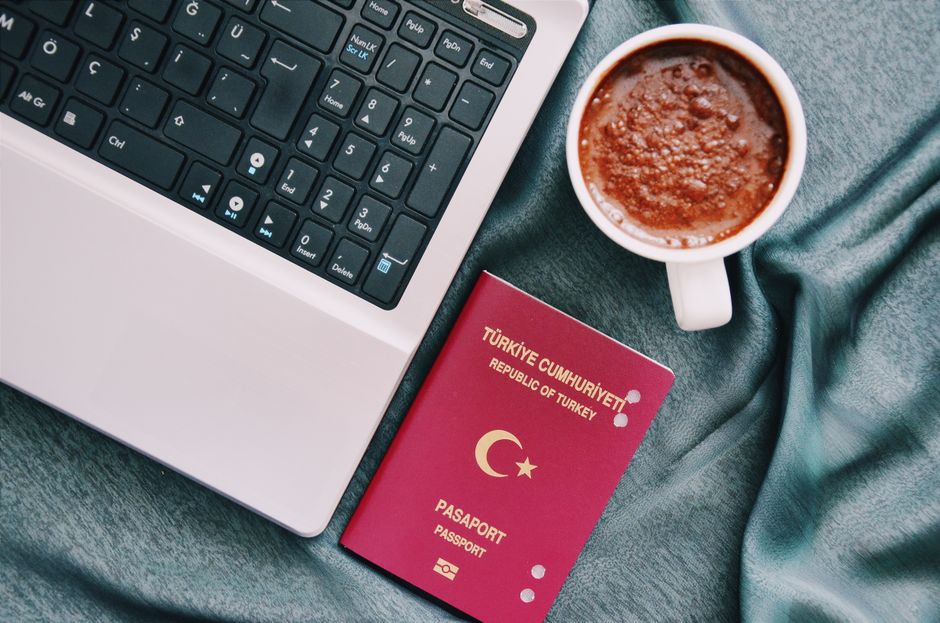 ETIAS application process completed on a laptop beside a passport