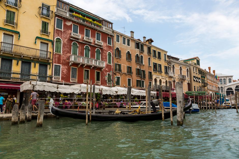 Venice canal with historic buildings and a gondola
