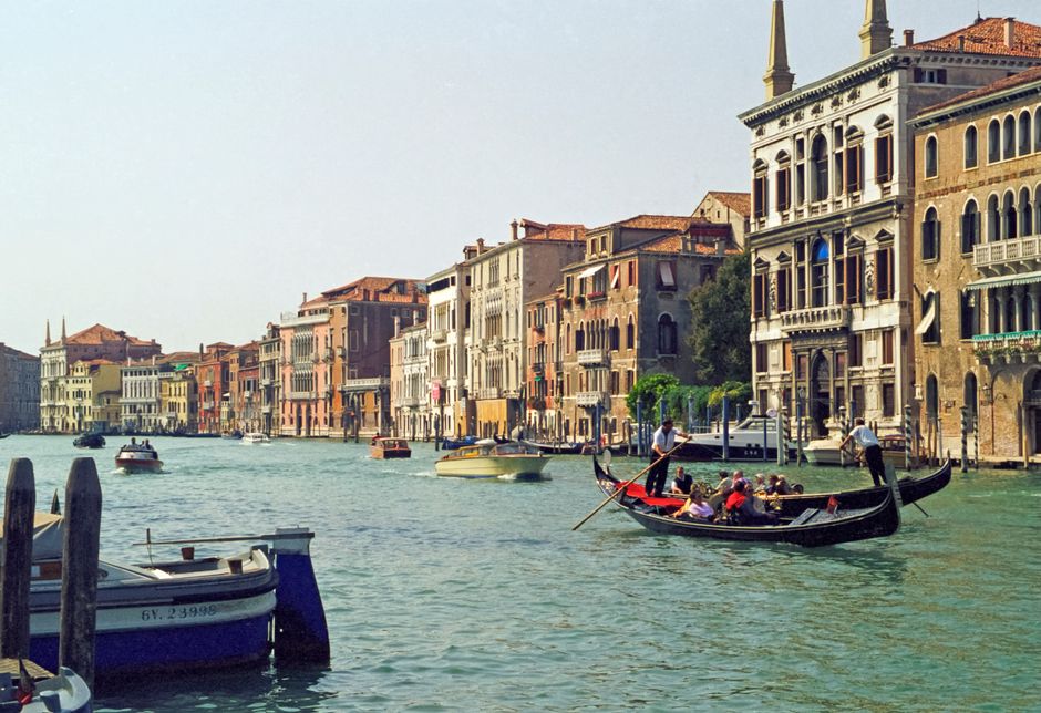 Traveller applying for ETIAS for Venice online beside a passport