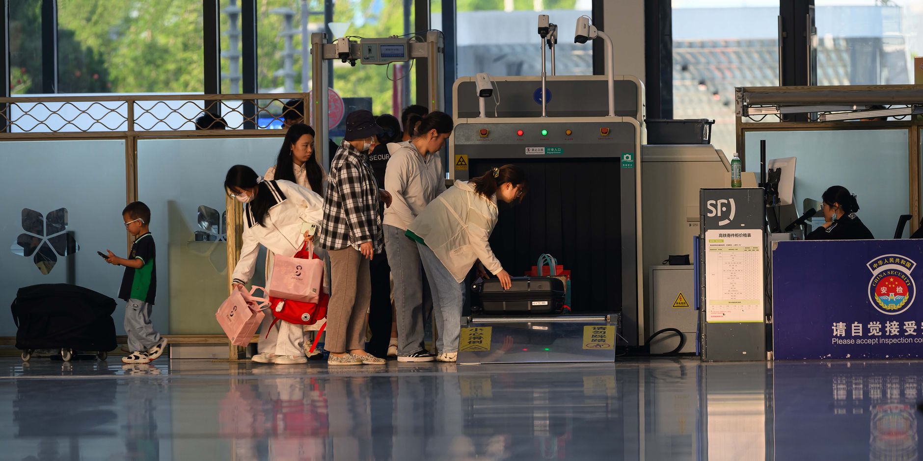 Long queue of international passengers waiting at an airport arrivals border hall