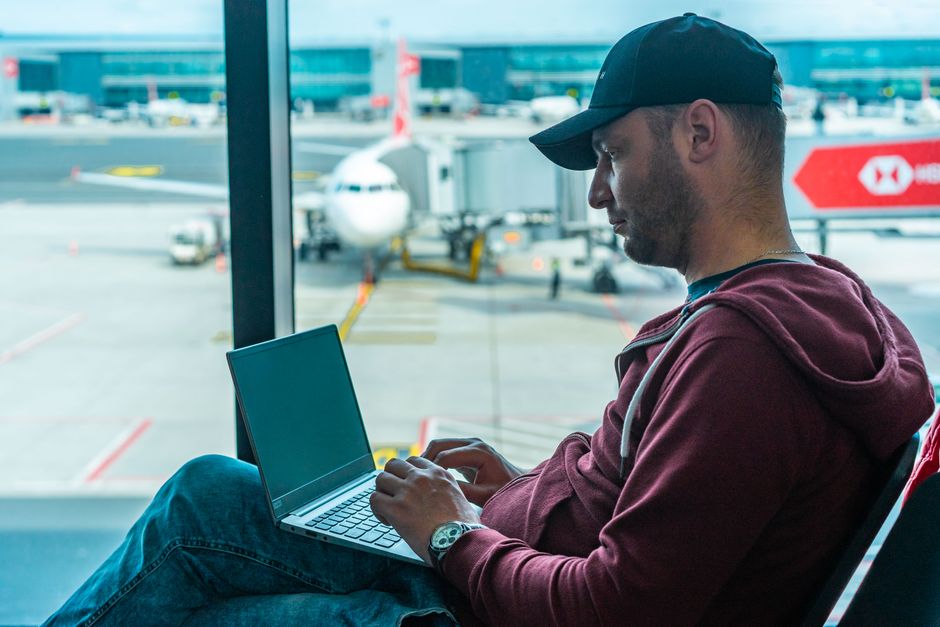 Traveller checking their ETIAS application status on a laptop at home