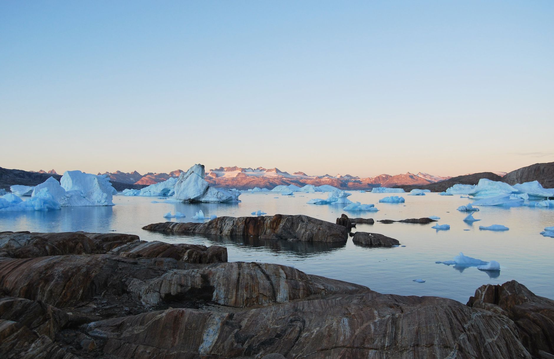 Aerial view of an icy North Atlantic fjord reached via a Copenhagen connection