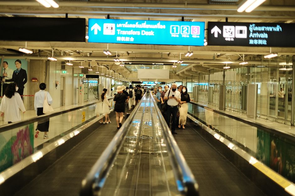Departure gate board showing connecting flights during an airport layover in Europe