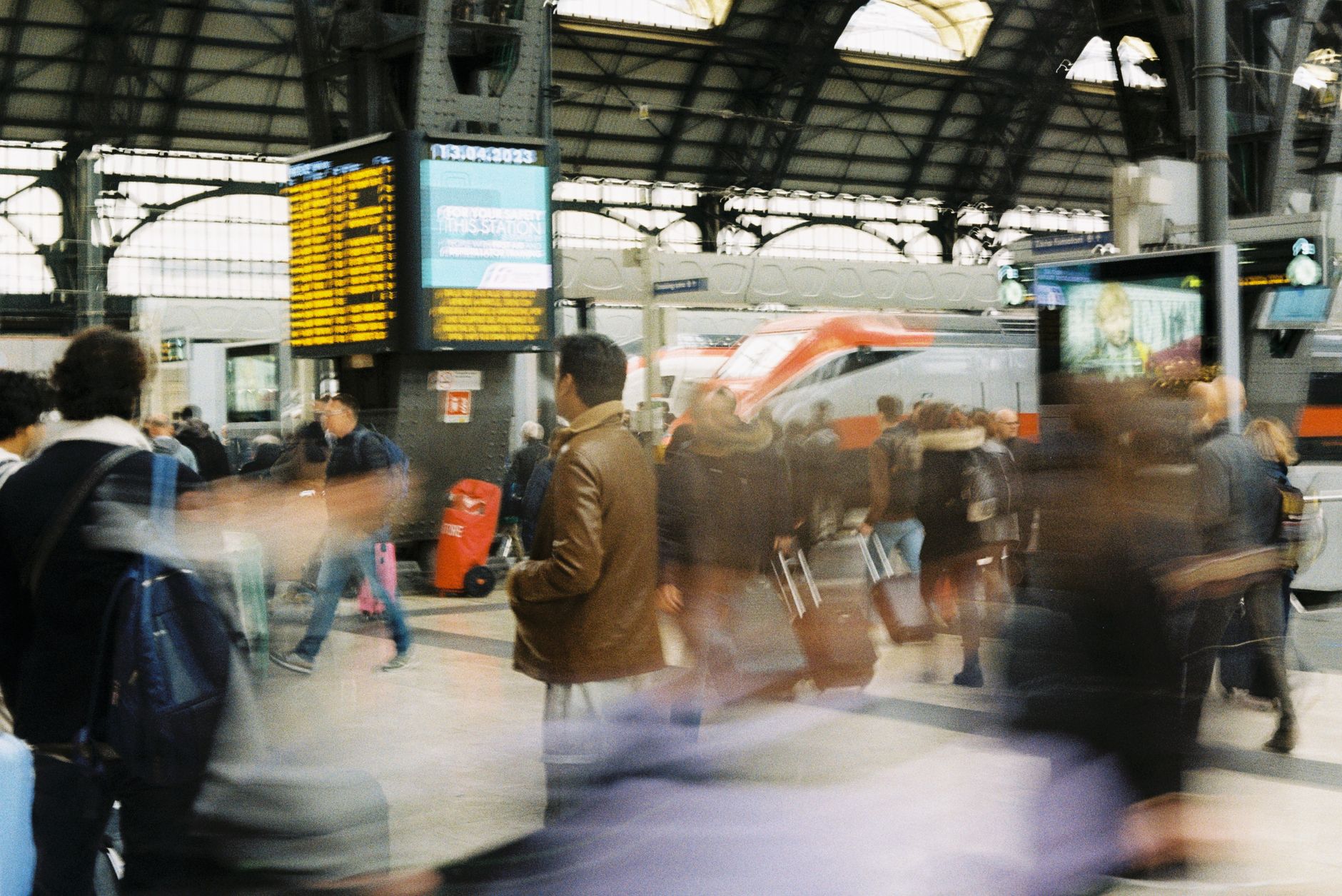Eurostar train at a London station platform with passengers boarding