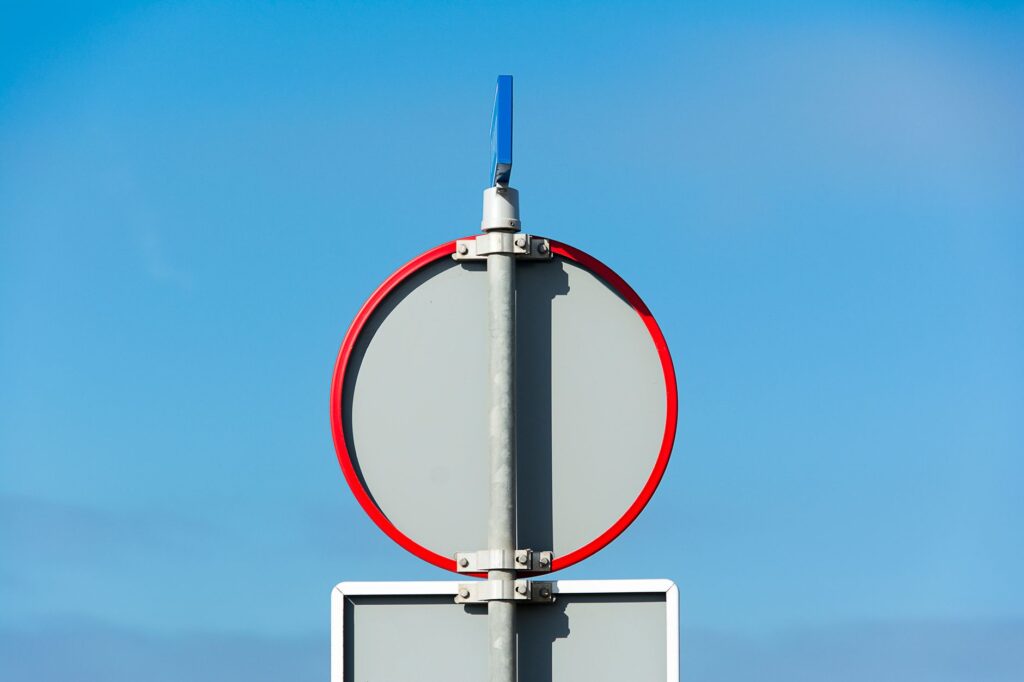 Road sign marking a Schengen area border crossing between two European countries