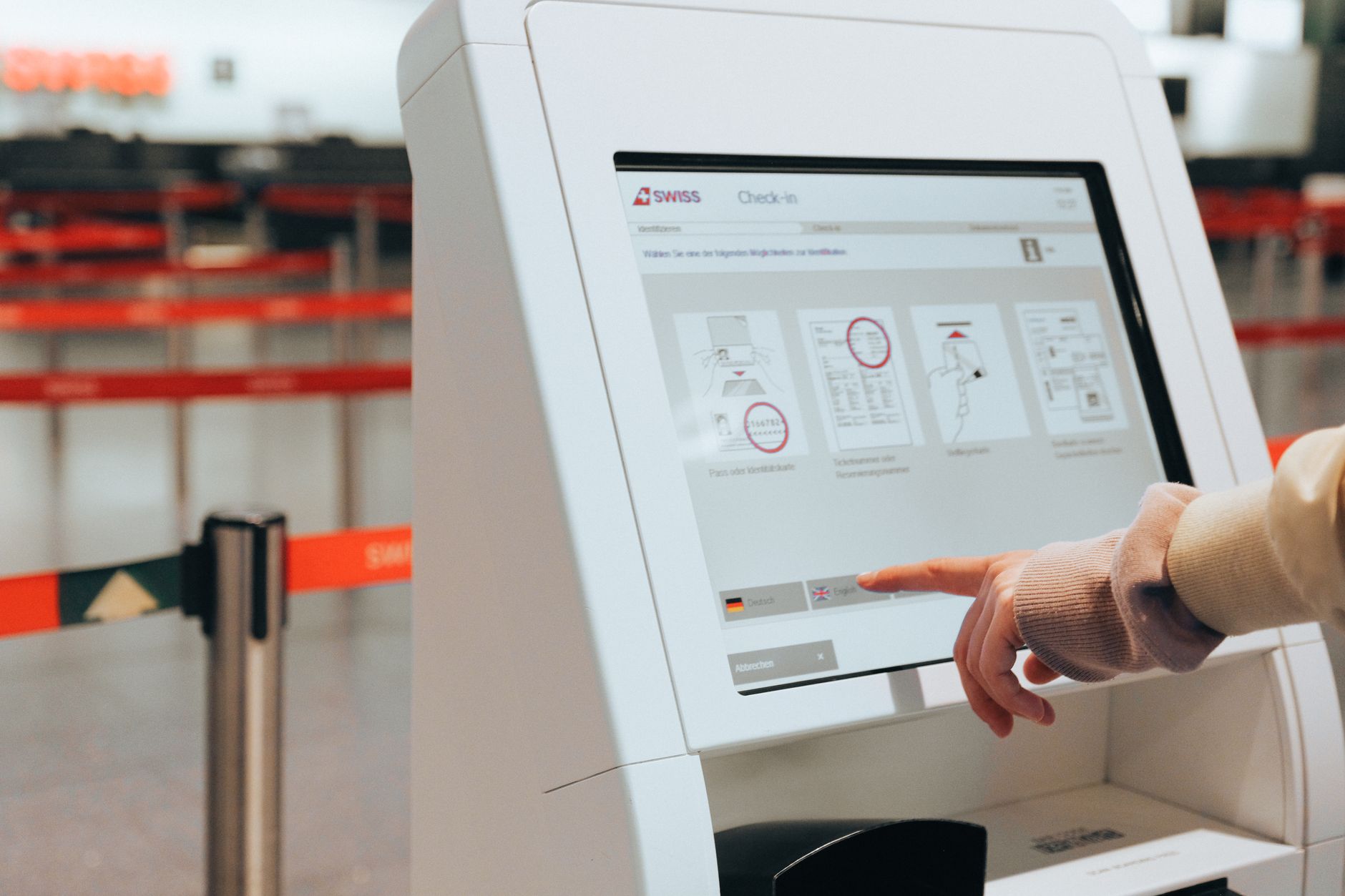 Bank of self-service border kiosks with cameras in an airport hall