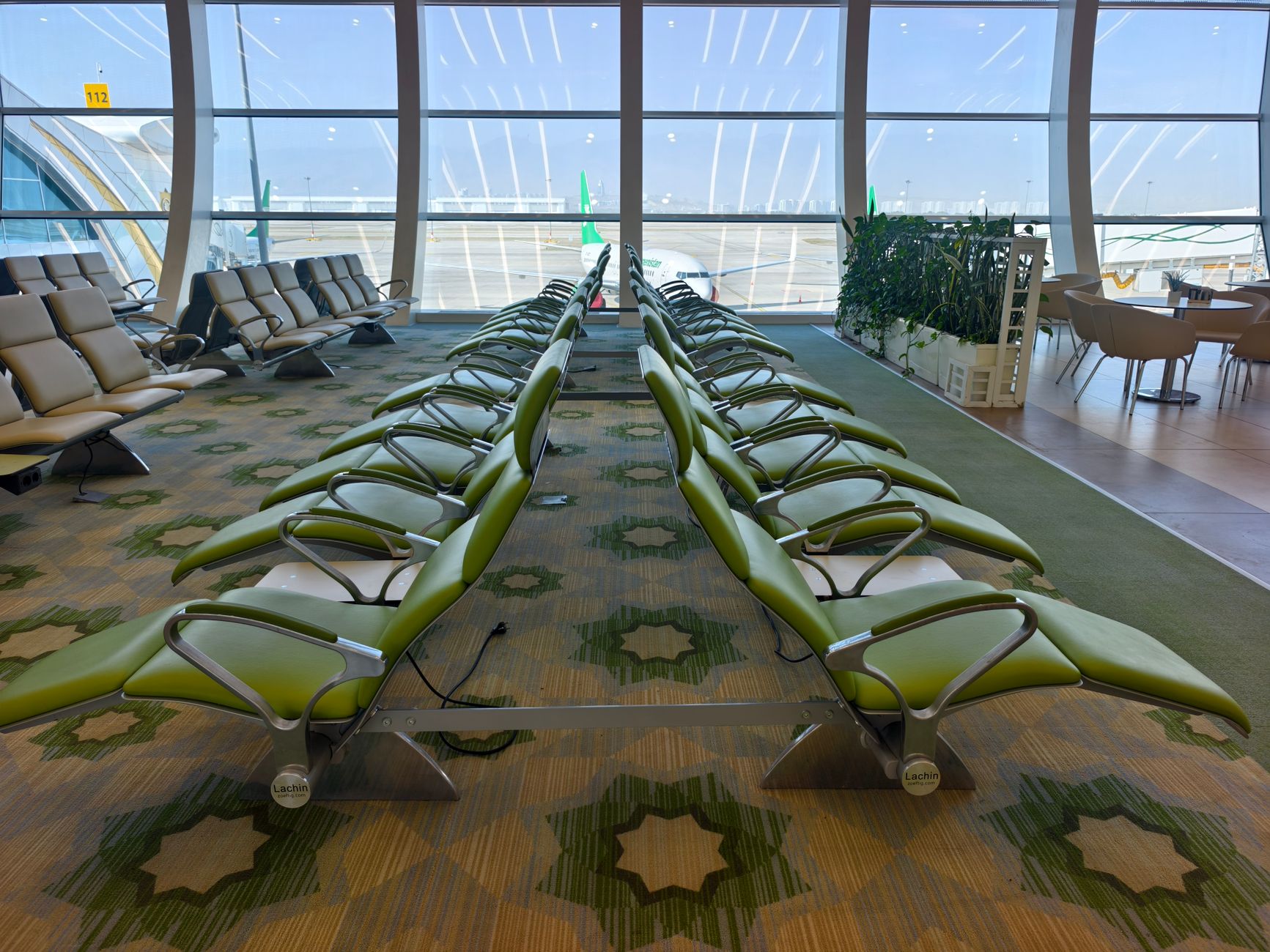 Traveller resting during a long layover, weighing whether ETIAS for a layover is needed before leaving the transit zone